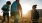 a group of people hike across a field